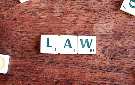 LAW spelled out with scrabble tiles